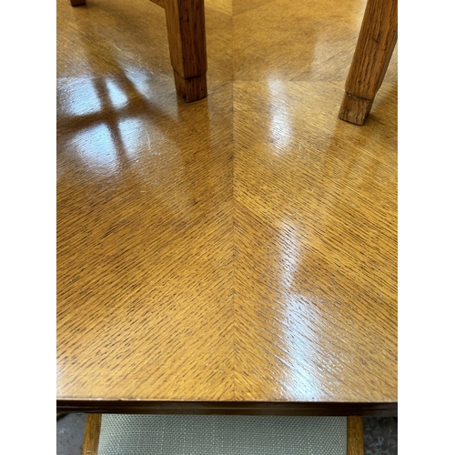 136 - An Art Deco oak and walnut dining table and four matching chairs