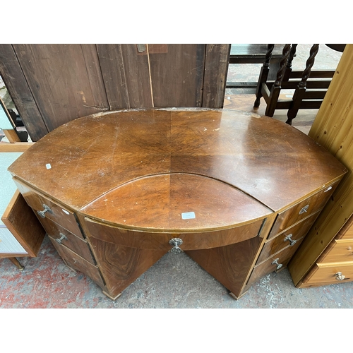 155 - An Art Deco style walnut bow fronted desk