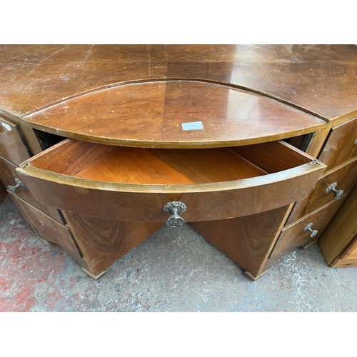 155 - An Art Deco style walnut bow fronted desk