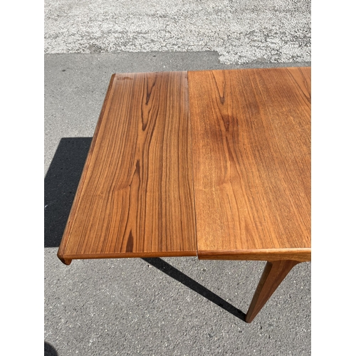 185 - A Younger teak rectangular extending dining table - approx. 73cm high x 93cm wide x 242cm long when ... 