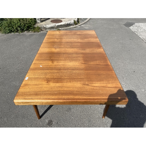 185 - A Younger teak rectangular extending dining table - approx. 73cm high x 93cm wide x 242cm long when ... 