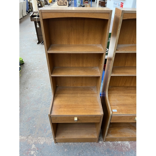 193 - A pair of mid 20th century teak effect bedside cabinets