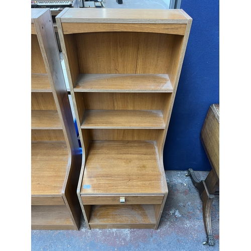 193 - A pair of mid 20th century teak effect bedside cabinets