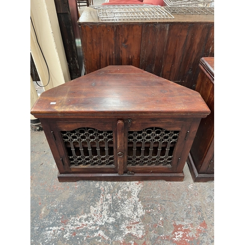 205 - Two pieces of Indian sheesham wood furniture, one TV stand and one bedside cabinet