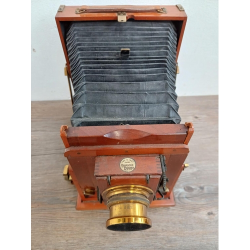 571 - A cased early 20th century mahogany and brass Thornton-Pickard Imperial Triple Extension folding fie... 