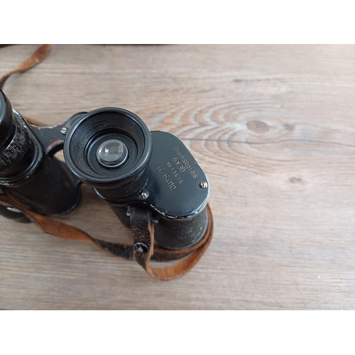 574 - A pair of German WWII military 6 x 30 binoculars marked cag »K.F.« Dienstglas No.13616 H/6400 with c... 