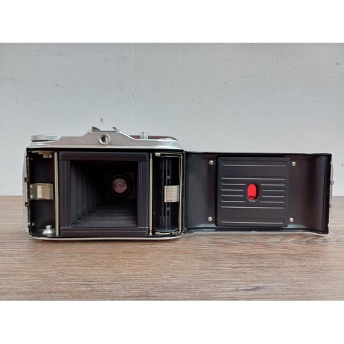 577 - A cased 1950s Agfa Isolette I folding camera fitted with Agnar 1:4.5/85 lens and Vario shutter