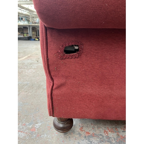 239 - A Victorian red fabric upholstered drop arm sofa