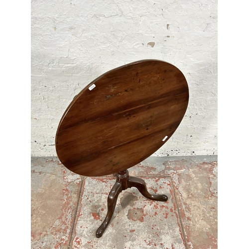 103 - A Georgian mahogany tilt top tripod pedestal circular occasional table - approx. 108cm high when til... 