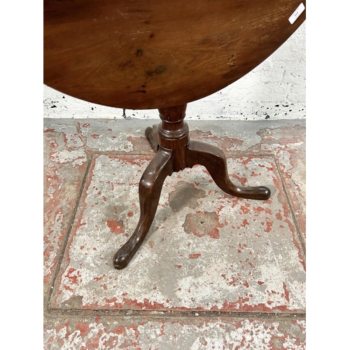 103 - A Georgian mahogany tilt top tripod pedestal circular occasional table - approx. 108cm high when til... 