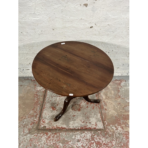 103 - A Georgian mahogany tilt top tripod pedestal circular occasional table - approx. 108cm high when til... 