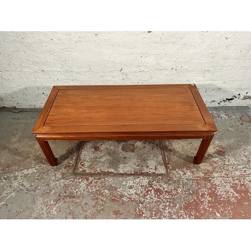 105 - A Chinese hardwood rectangular coffee table - approx. 40cm high x 56cm wide x 122cm long