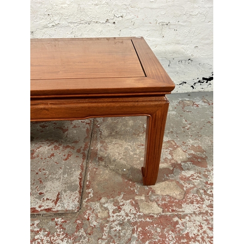 105 - A Chinese hardwood rectangular coffee table - approx. 40cm high x 56cm wide x 122cm long