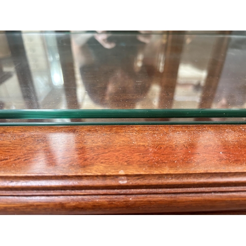 108 - A Chinese hardwood and bevelled glass display cabinet with two glass shelves and cabriole supports -... 