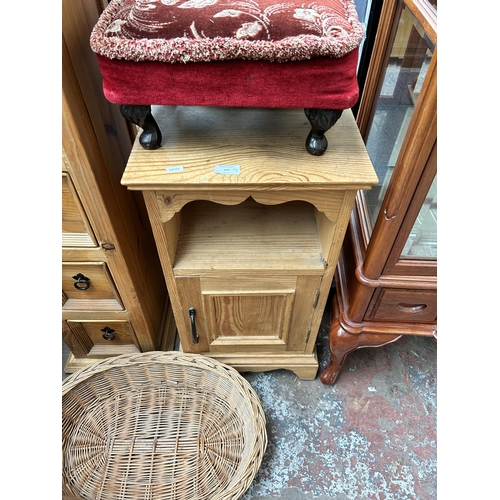 109 - Four pieces of furniture - pine chest of drawers, pine bedside cabinet, wicker basket and red floral... 