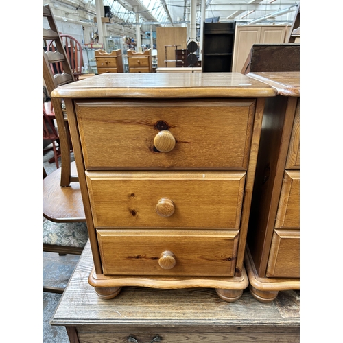 116 - A pair of pine bedside chests of drawers - approx. 61cm high x 46cm wide x 38cm deep