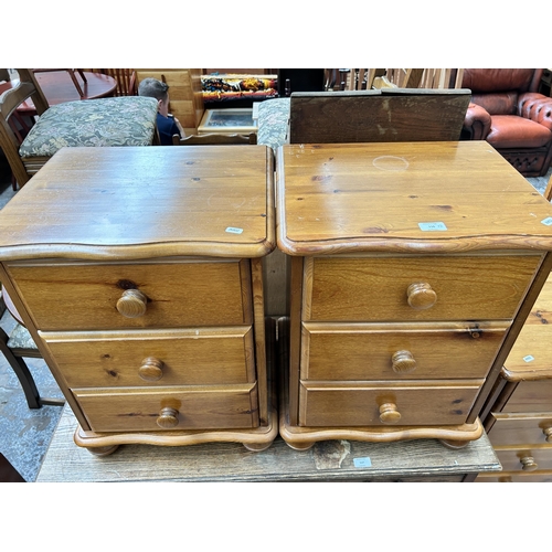 116 - A pair of pine bedside chests of drawers - approx. 61cm high x 46cm wide x 38cm deep