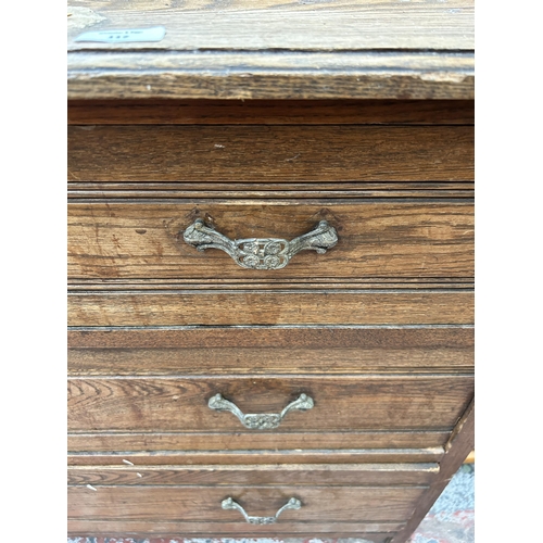 117 - An Edwardian oak chest of drawers - approx. 78cm high x 107cm wide x 51cm deep