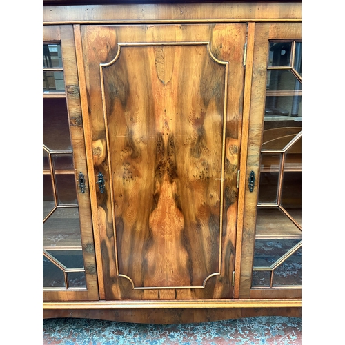 118 - A Georgian style yew wood astral glazed bookcase with bracket supports - approx. 107cm high x 136cm ... 