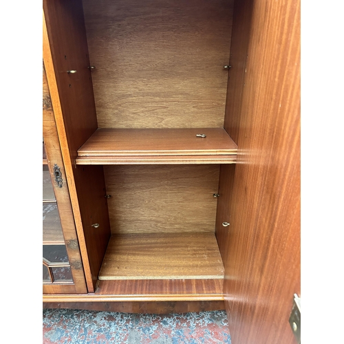 118 - A Georgian style yew wood astral glazed bookcase with bracket supports - approx. 107cm high x 136cm ... 