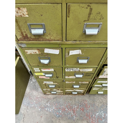 121 - A green painted metal twelve drawer index filing cabinet - approx. 132cm high x 52cm wide x 51cm dee... 