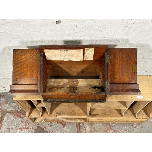 122 - Two items, one early 20th century oak stationary box and one late 19th/early 20th century pigeon hol... 