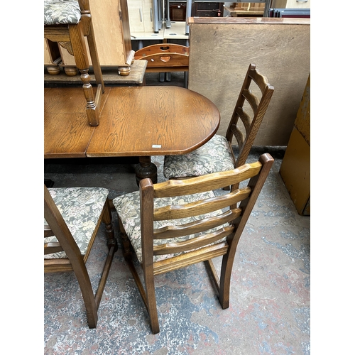 123 - An oak twin pedestal extending dining table and six chairs