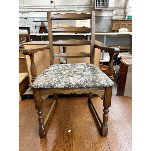 123 - An oak twin pedestal extending dining table and six chairs