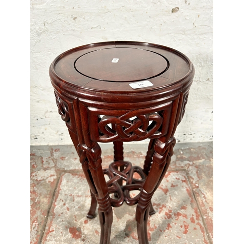 129 - An Oriental carved hardwood jardinière stand - approx. 77cm high x 31cm diameter