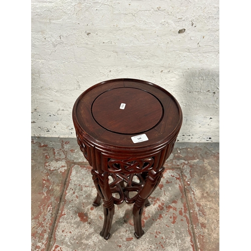 129 - An Oriental carved hardwood jardinière stand - approx. 77cm high x 31cm diameter