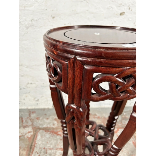 129 - An Oriental carved hardwood jardinière stand - approx. 77cm high x 31cm diameter