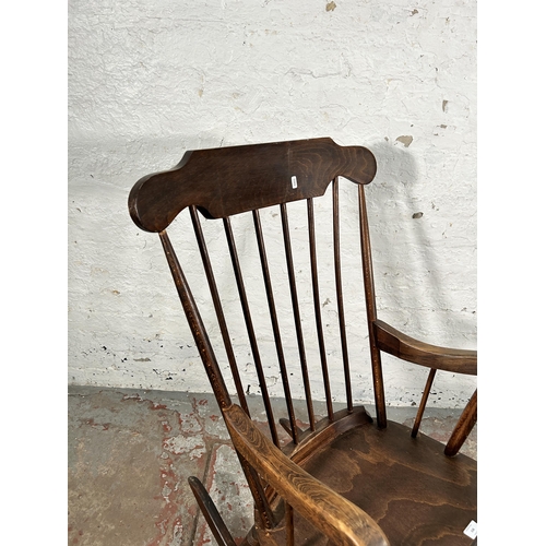 138 - A beech spindle back rocking chair