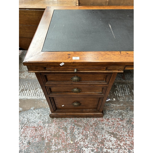 139 - A 19th century style reclaimed pine twin pedestal desk with black leather writing surface - approx. ... 