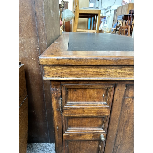 139 - A 19th century style reclaimed pine twin pedestal desk with black leather writing surface - approx. ... 