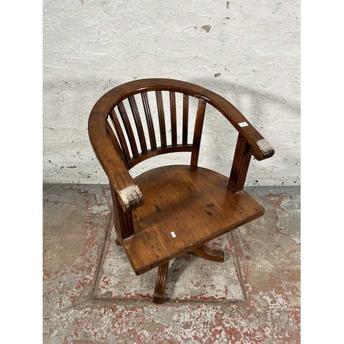 140 - A reclaimed pine captain's swivel office desk chair