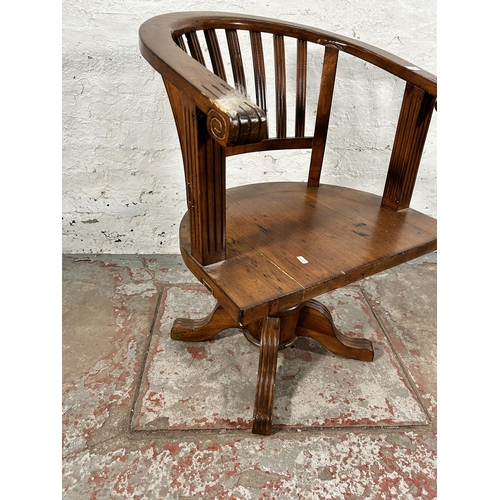 140 - A reclaimed pine captain's swivel office desk chair