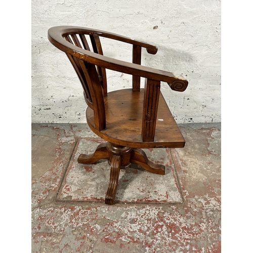 140 - A reclaimed pine captain's swivel office desk chair