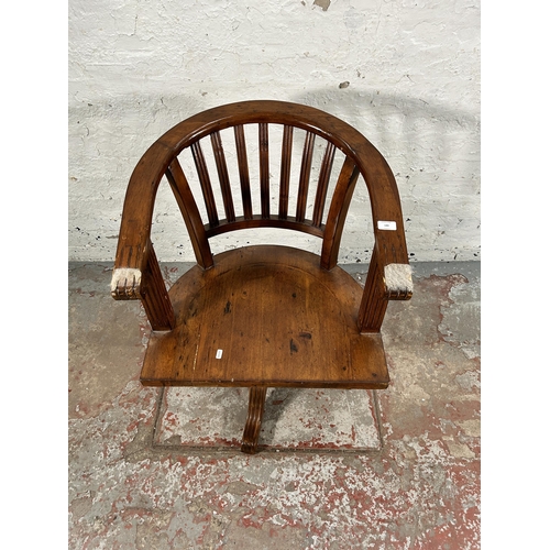 140 - A reclaimed pine captain's swivel office desk chair