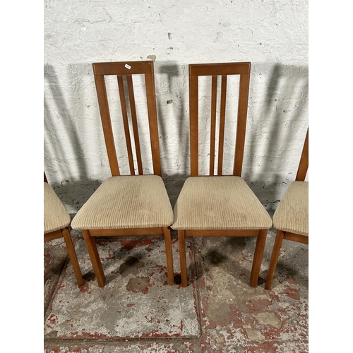 142 - Four modern beech and brown fabric upholstered dining chairs