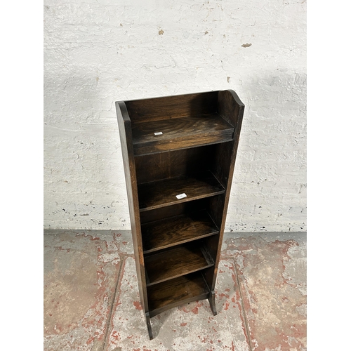 143 - An early/mid 20th century oak five tier open bookcase - approx. 119cm high x 38cm wide x 23cm deep