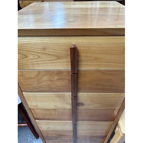 144 - Three pieces of furniture - yew wood and teak chest of drawers, beech and clear glass side table and... 