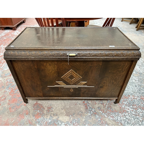 147 - A mid 20th century carved oak blanket box