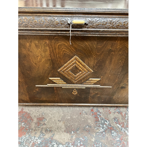 147 - A mid 20th century carved oak blanket box