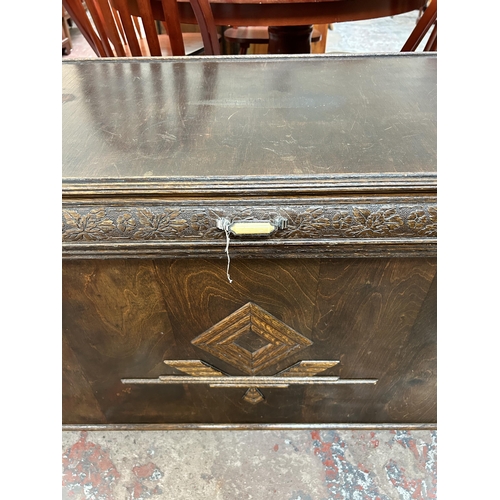 147 - A mid 20th century carved oak blanket box