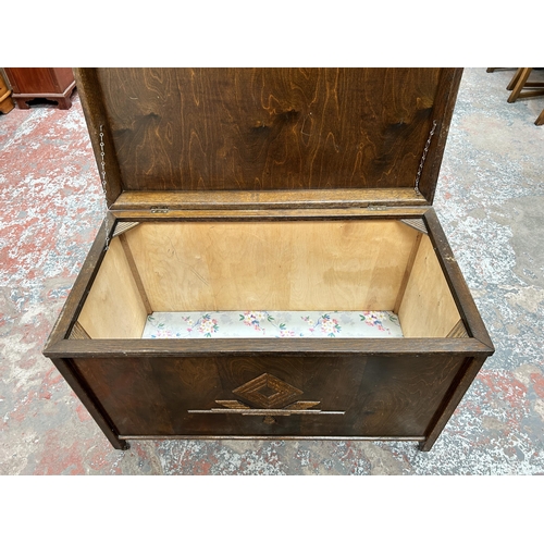 147 - A mid 20th century carved oak blanket box