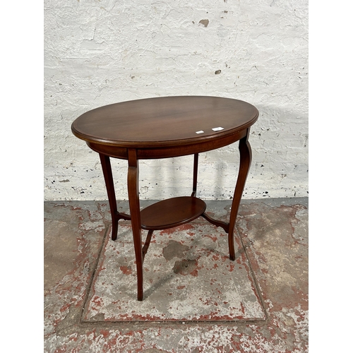 154 - An Edwardian inlaid mahogany oval two tier side table