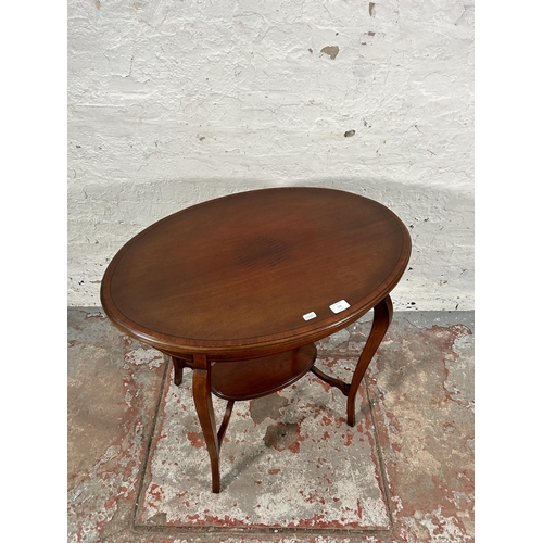 154 - An Edwardian inlaid mahogany oval two tier side table