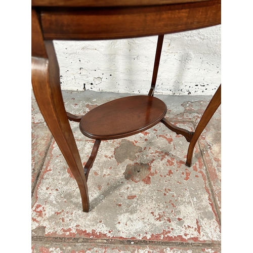 154 - An Edwardian inlaid mahogany oval two tier side table