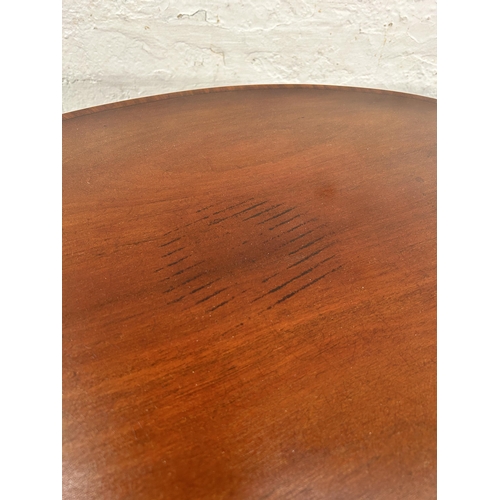 154 - An Edwardian inlaid mahogany oval two tier side table