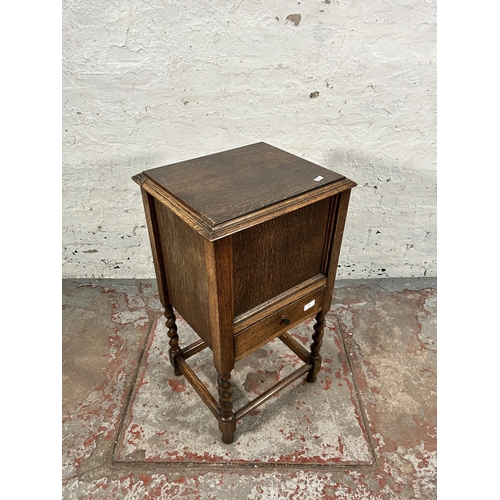 159 - A mid 20th century oak sewing cabinet on barley twist supports - approx. 73cm high x 40cm wide x 35c... 